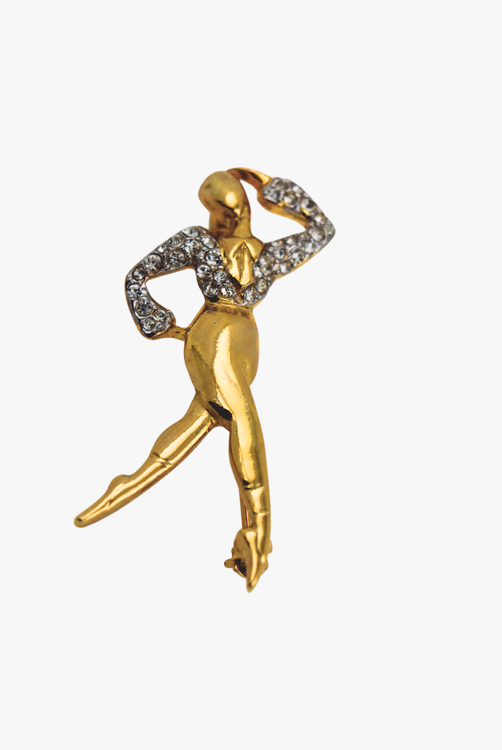 Broche en forme de danseur dorée avec détail de strass argenté sur le haut vintage