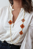 Sautoir avec quatre motifs trèfle à quatre feuilles en pâte de verre fait à la main en France