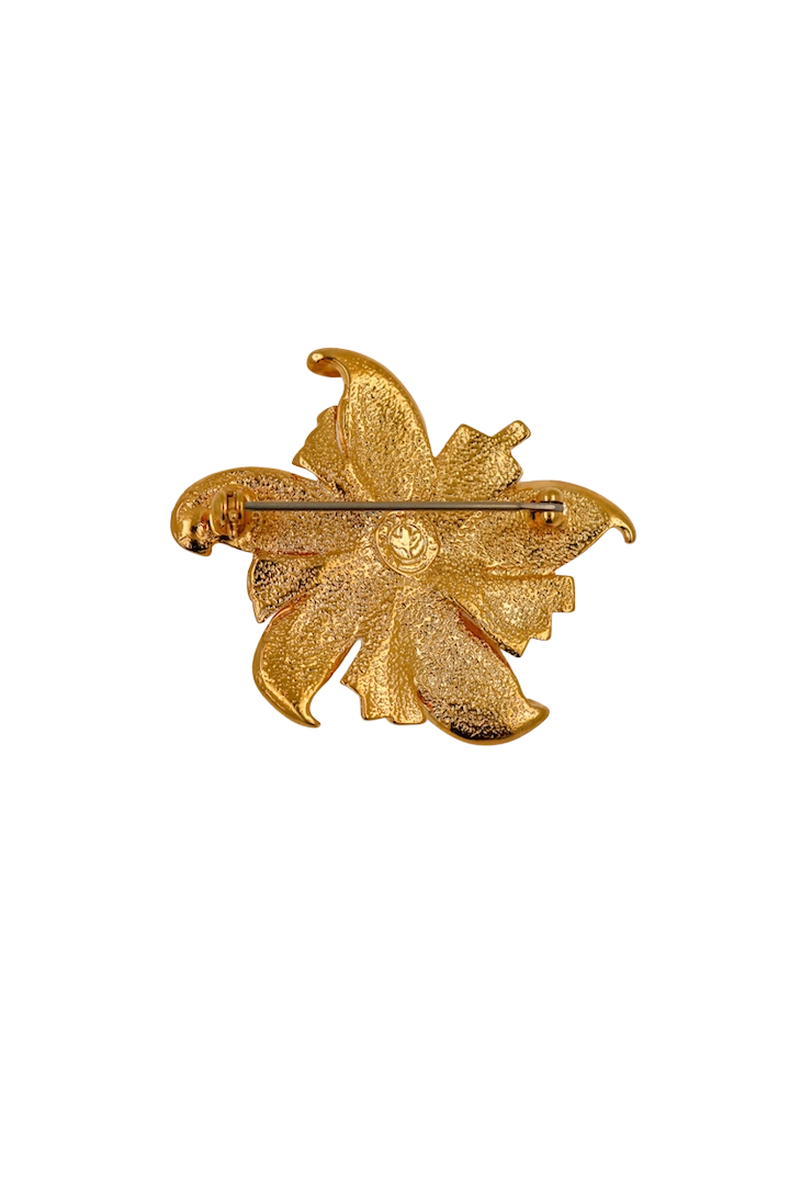 Broche en forme de fleur dorée vintage ornée de strass cristal 