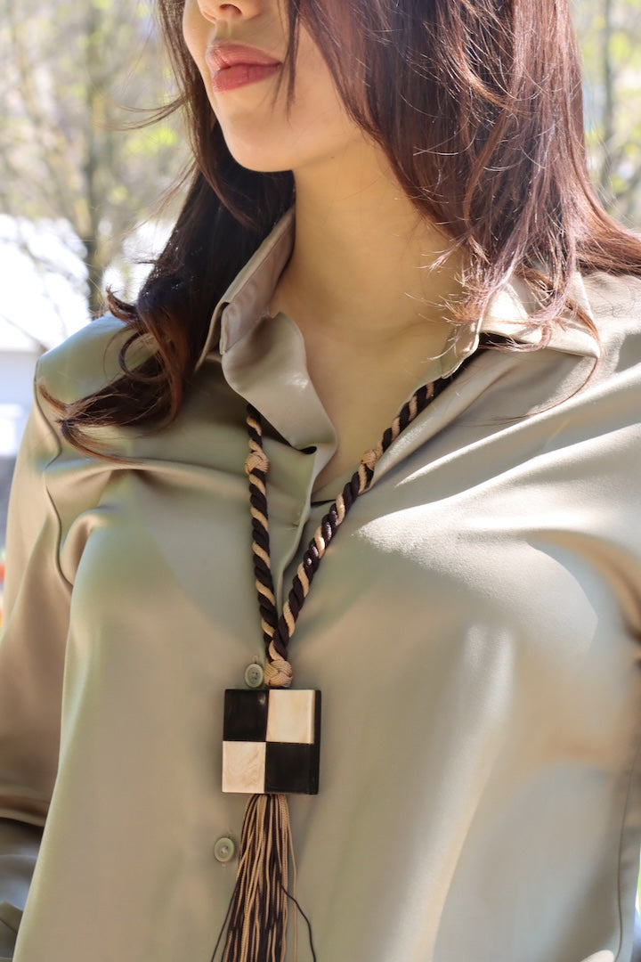 Sautoir Yves Saint Laurent corde et bois vintage signé