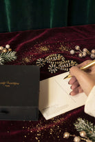 carte de cadeau idée cadeau de Noel à partir de 50 euros paire de boucles d'oreilles pendantes noire et dorée 